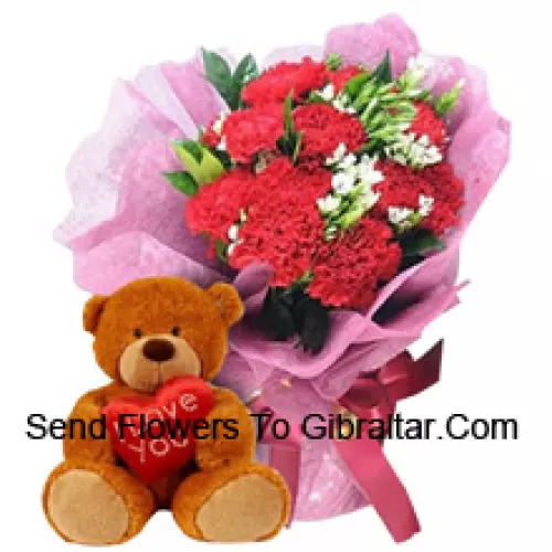 Bunch Of 11 Red Carnations With Seasonal Fillers Along With A Cute 12 Inches Tall Brown Teddy Bear