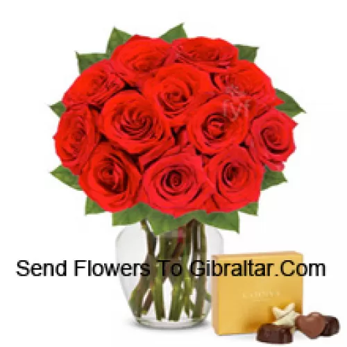 11 Red Roses With Some Ferns In A Glass Vase Accompanied With An Imported Box Of Chocolates