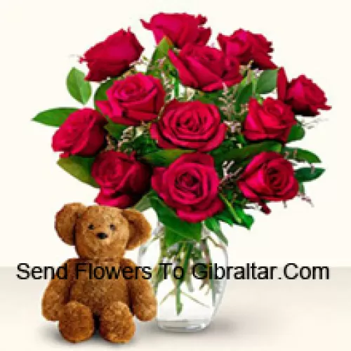 11 Red Roses With Some Ferns In A Glass Vase Along With A Cute 12 Inches Tall Brown Teddy Bear