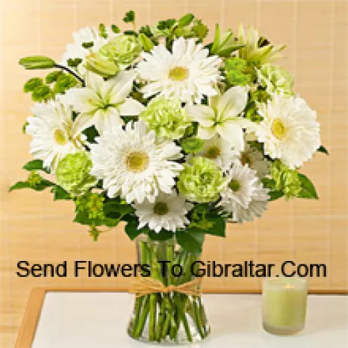 White Gerberas, White Alstroemeria And Other Assorted Seasonal Flowers Arranged Beautifully In A Glass Vase