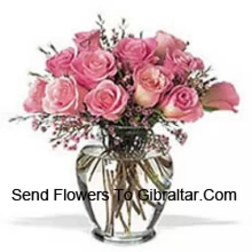 Bunch Of 11 Pink Roses With Some Ferns In A Vase