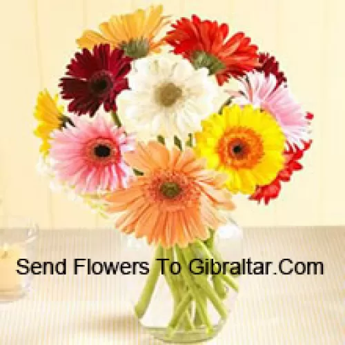 Assorted Colored Daisies In A Glass Vase