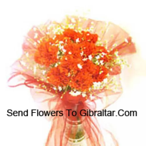 11 Orange Carnations With Some Ferns In A Vase