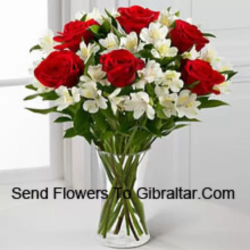 7 Red Roses With Assorted White Flowers And Fillers In A Glass Vase