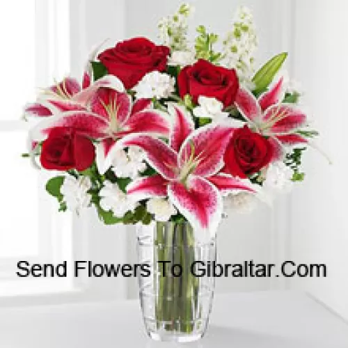 Red Roses, Pink Lilies With Assorted White Flowers In A Glass Vase