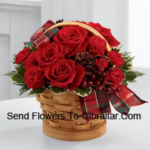 Greet your special recipient with seasonal beauty and blessings. Red roses and mini carnations are gorgeously arranged in a natural woodchip basket with assorted holiday greens, natural pinecones, and berry pics, accented with a tartan plaid ribbon to create a gift that wishes everything this wondrous season has to offer (Please Note That We Reserve The Right To Substitute Any Product With A Suitable Product Of Equal Value In Case Of Non-Availability Of A Certain Product)